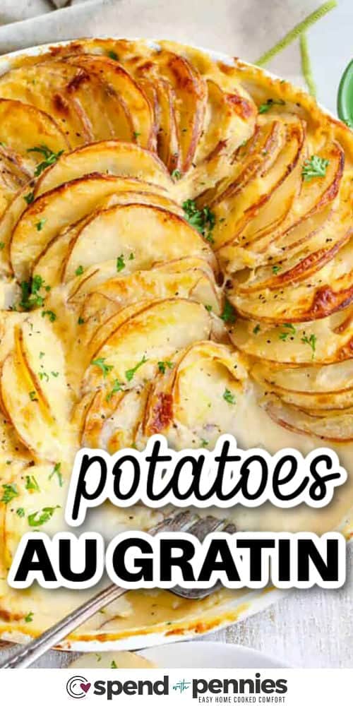 This potatoes au gratin recipe is creamy, cheesy, and baked until golden brown for a side dish that’s pure comfort. With layers of tender potatoes, onions, and a homemade cheese sauce, this recipe is the best way to bring cozy flavor to the table. Simple to cook and delicious served with ham. #spendwithpennies plated Potatoes Au Gratin with writing