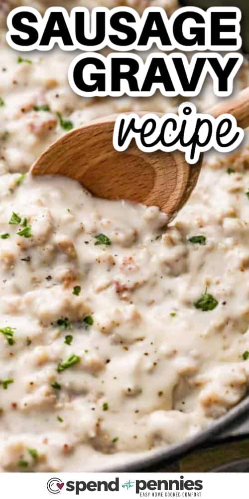 Make this sausage gravy recipe for a rich and hearty sauce that is packed with flavor. Not only is it smooth and comforting, but it is also so easy to make. It all begins with juicy and tender breakfast sausage that is pan fried with butter and flour. Slowly, milk is added to the mix until a velvety smooth roux with morsels of sausage is made. This is best for spooning over fluffy biscuits to soak up the gravy, or potatoes, or as a base for a casserole. #spendwithpennies Sausage Gravy Recipe with a wooden spoon and a title