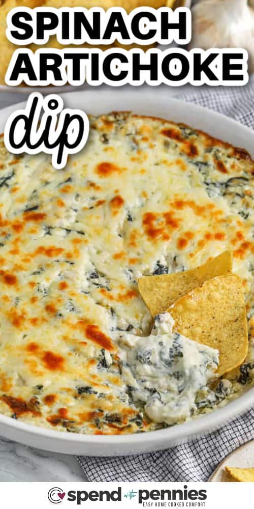 This spinach artichoke dip is smooth, cheesy, and perfectly baked for a golden top and creamy center. With cream cheese, sour cream, mozzarella, and parmesan, every bite is loaded with rich flavor. Serve warm with bread or veggies for dipping. This easy appetizer is always the best start to any meal or party spread. #spendwithpennies baked spinach artichoke dip with tortilla chips and writing