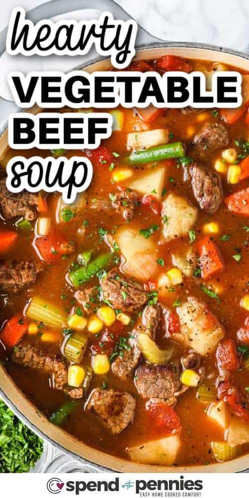 hearty Vegetable Beef Soup in a pot with a title