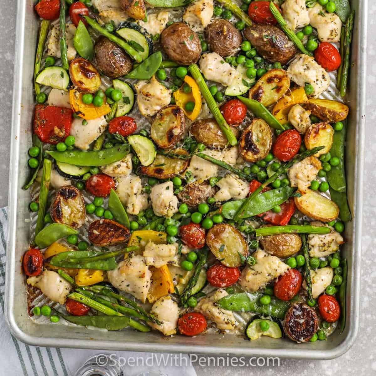 Spring vegetables and chicken roasted on a Sheet Pan