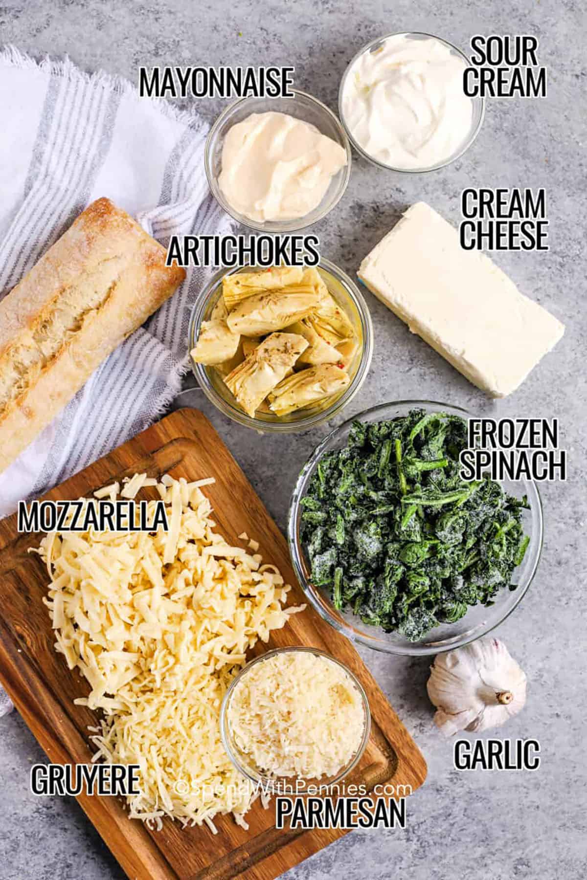 Spinach artichoke dip is a cheesy, creamy favorite that’s easy to make and even easier to love. This baked recipe combines cream cheese, sour cream, and melted cheese with spinach and marinated artichokes for the perfect blend of flavor. Serve it hot from the oven with crostini, tortilla chips, or crusty bread. Everyone will ask for the recipe after the first bite. #spendwithpennies ingredients with labels to make spinach artichoke dip