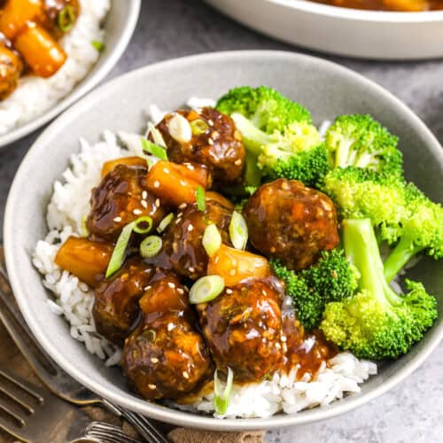 A bowl of teriyaki meatballs with broccoli and pineapple
