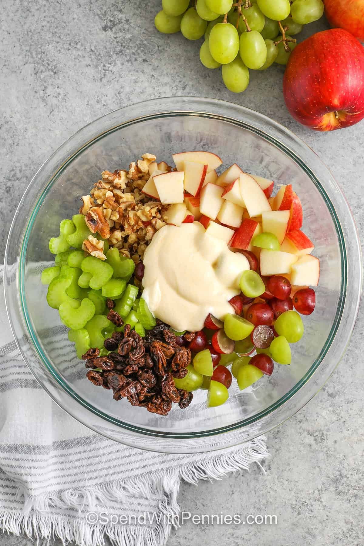 waldorf salad unmixed in a glass bowl