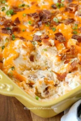 close up of cheesy Twice Baked Potato Casserole with bacon