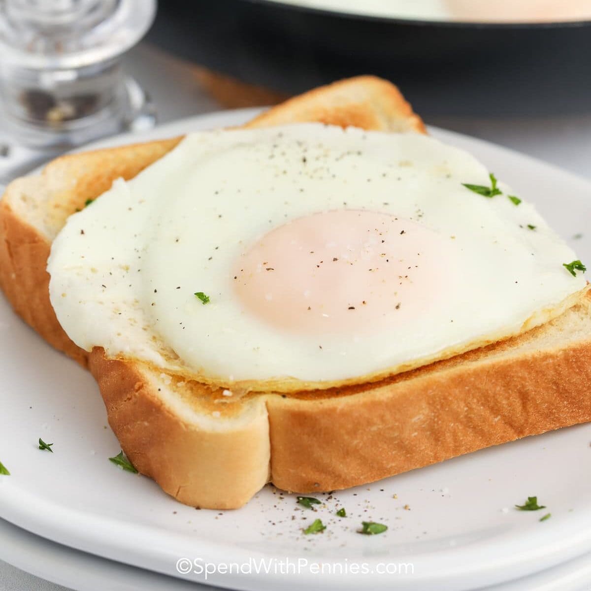 a basted egg on a piece of toast
