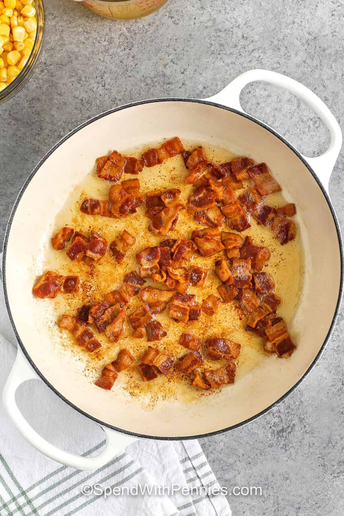 chopped bacon cooking in a dutch oven