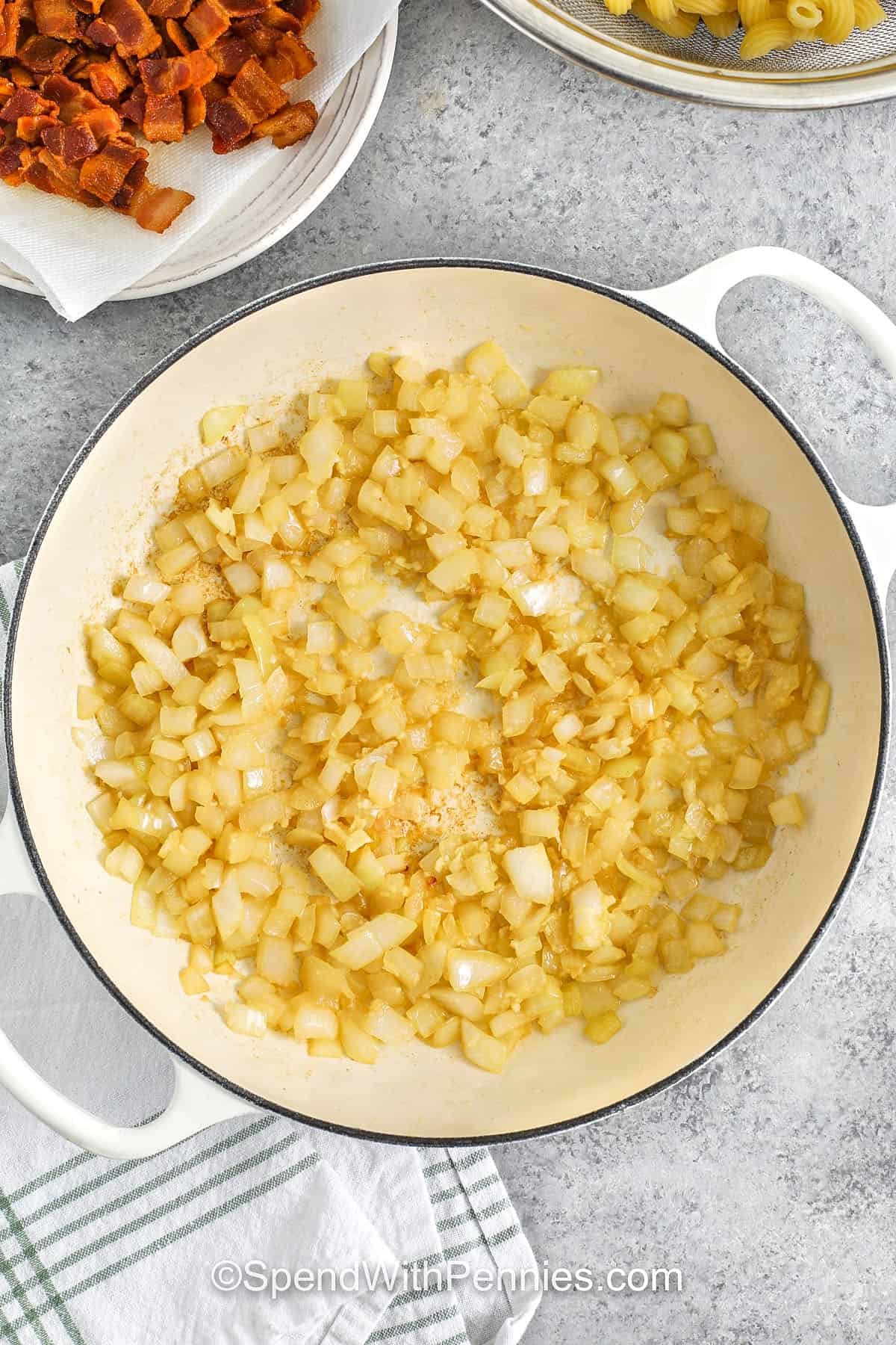 cooking onion to make corn pasta