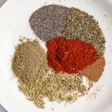 spices to make turkey seasoning on a plate