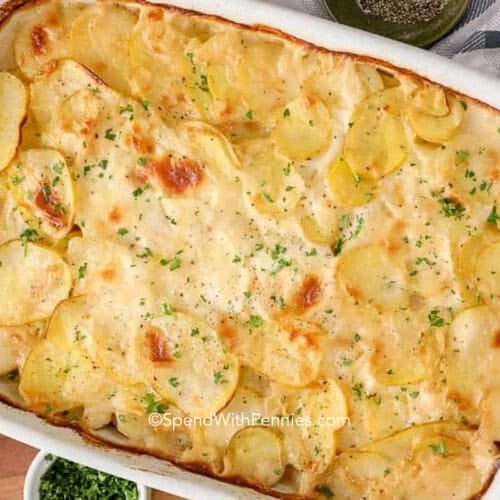A casserole dish filled with with a scalloped potato recipe
