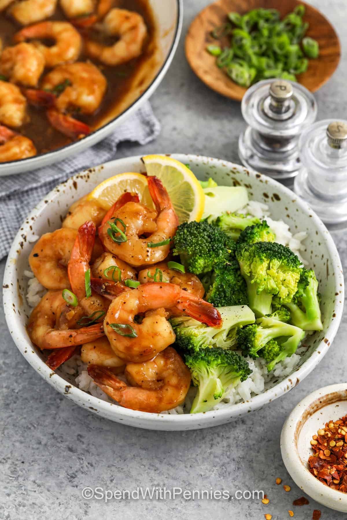 honey garlic shrimp in a bowl with rice and broccoli