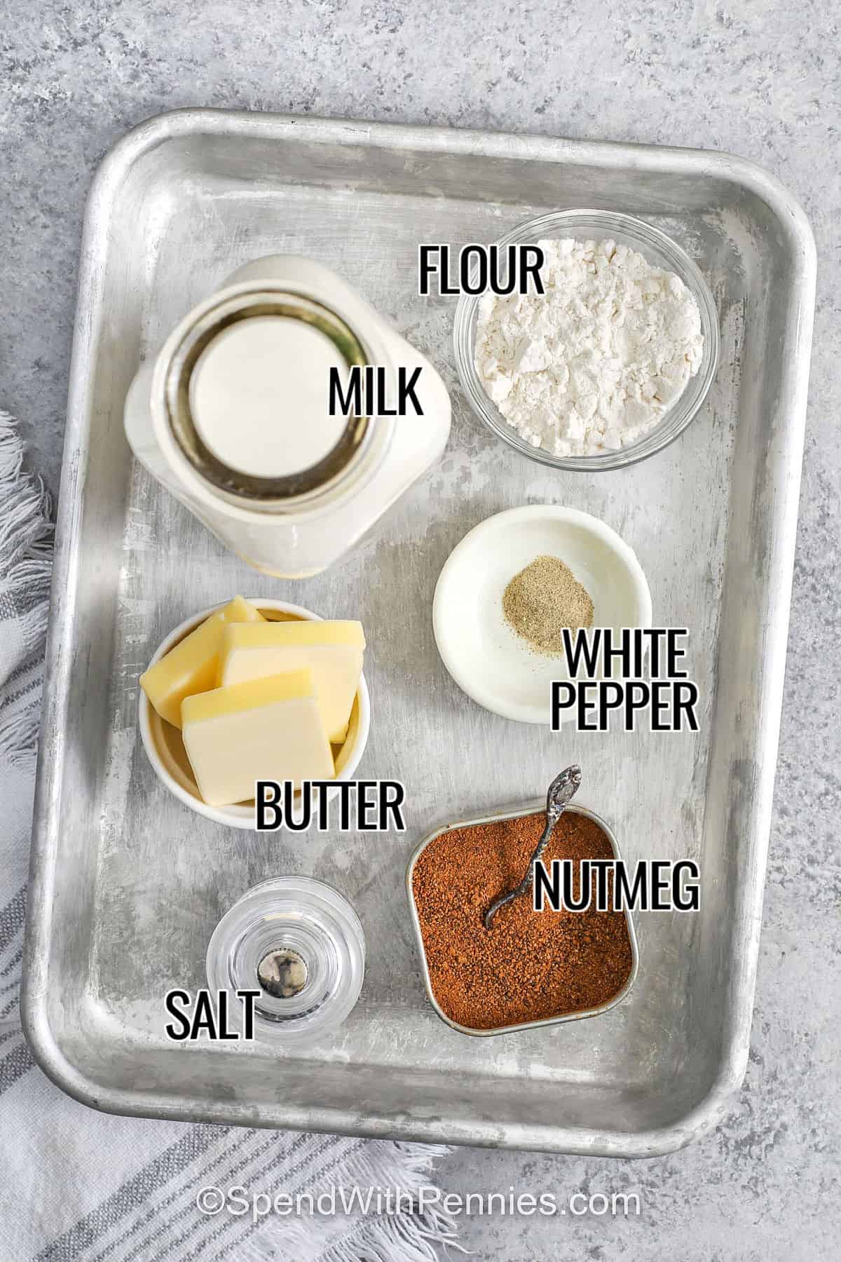milk , flour , white pepper , nutmeg , butter and salt with labels to make Bechamel