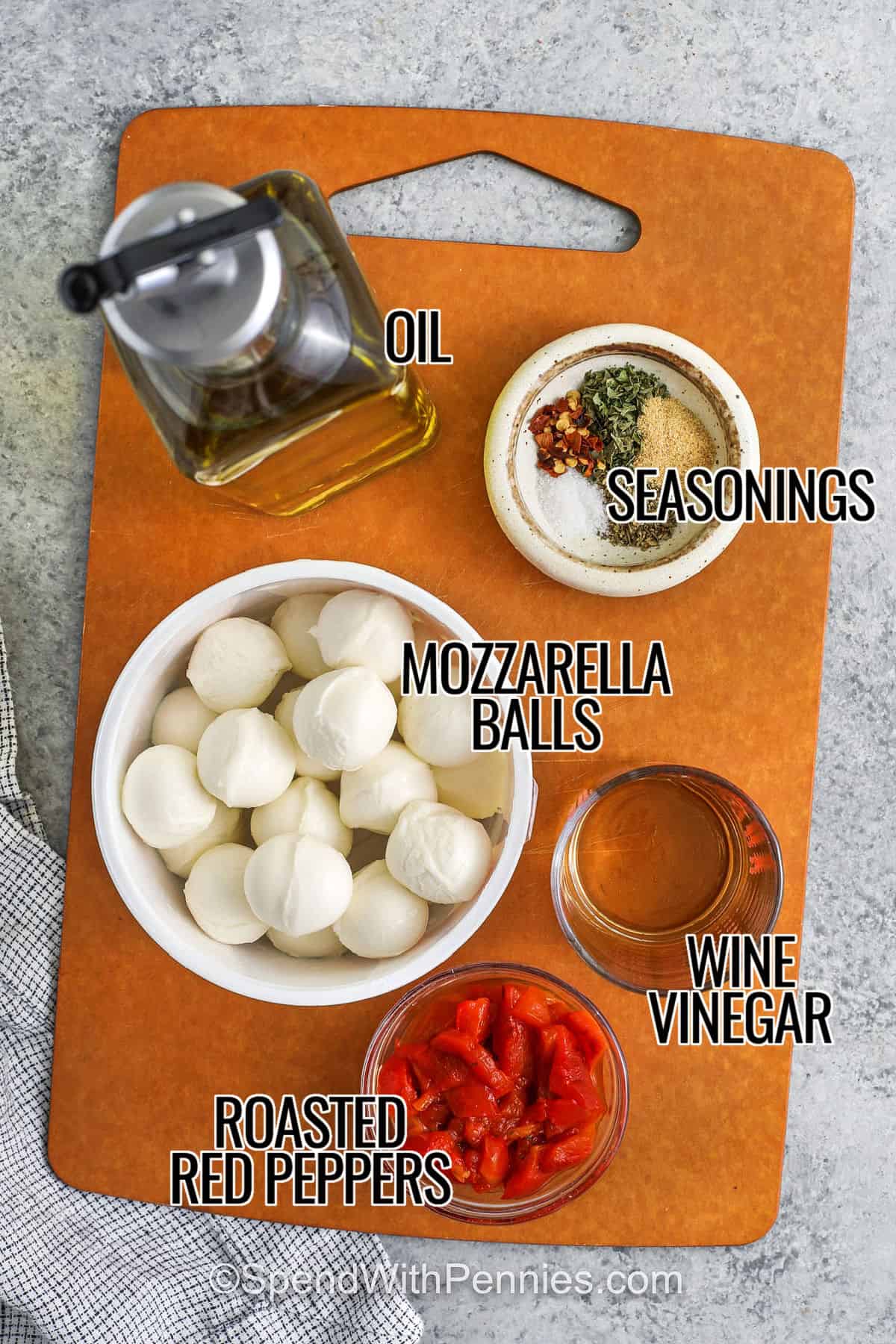 ingredients with labels to make marinated mozzarella balls
