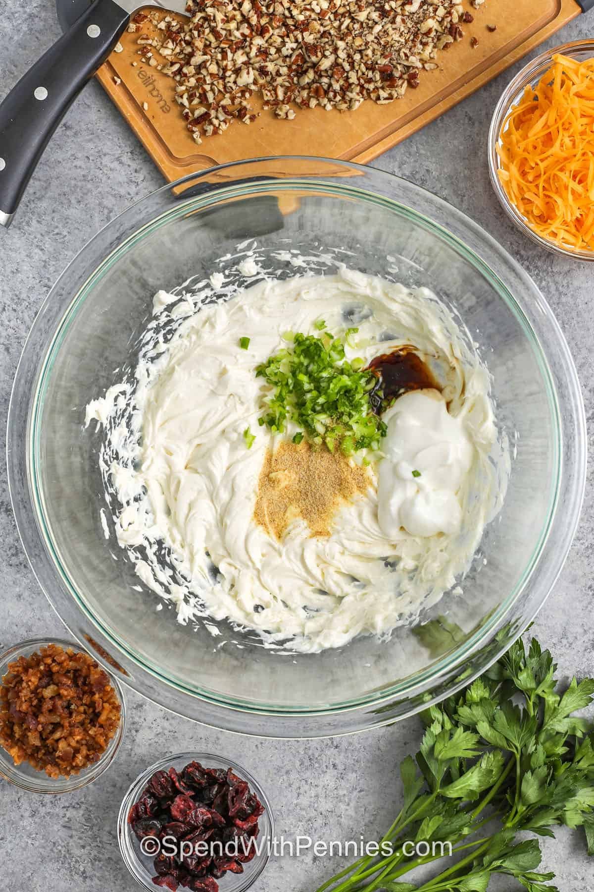 adding ingredients to bowl to make Mini Cheese Balls