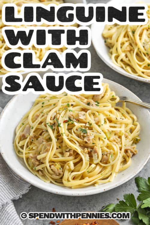 Linguine with clam sauce is a fresh take on a classic pasta dish. Umami clam sauce coats every strand with briny, bold flavor. This recipe blends tender clams, garlic, celery, and onion in a white wine sauce finished with butter and lemon zest. Tossed with perfectly cooked linguine, it’s the best way to make a weeknight feel special. Bright, savory, and full of fresh parsley, this dish is a pasta lover’s dream with a touch of gourmet charm. #spendwithpennies plated Linguine with Clam Sauce with writing