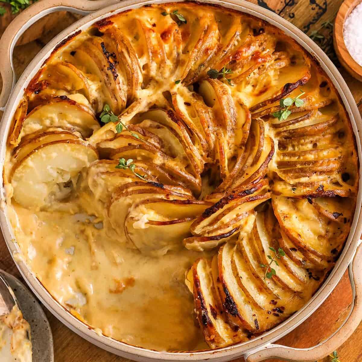 top view of baked potatoes au gratin with some taken out