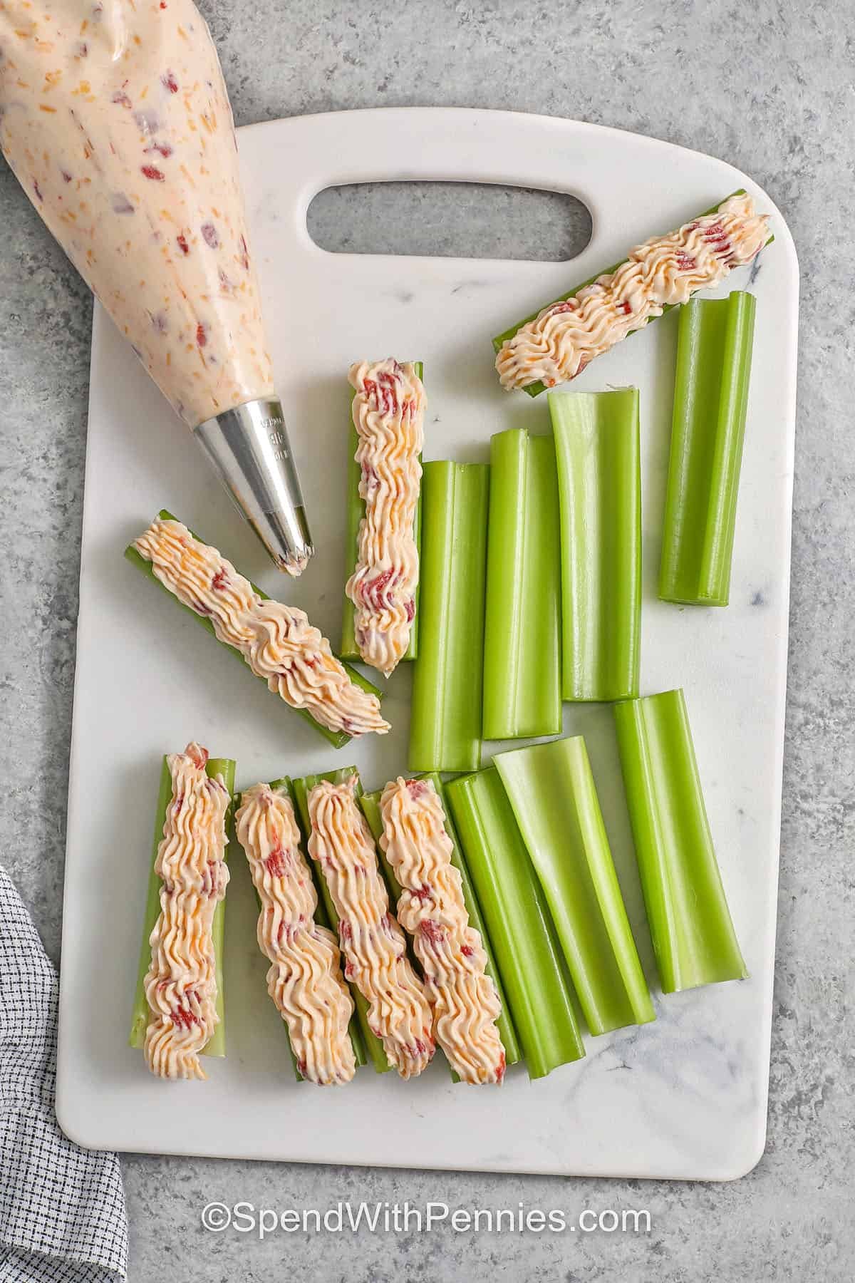 adding filling to celery to make Stuffed Celery