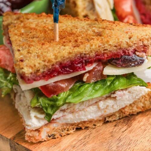 a turkey sandwich on a board