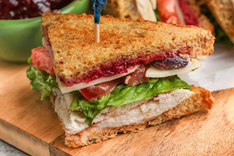 a turkey sandwich on a board