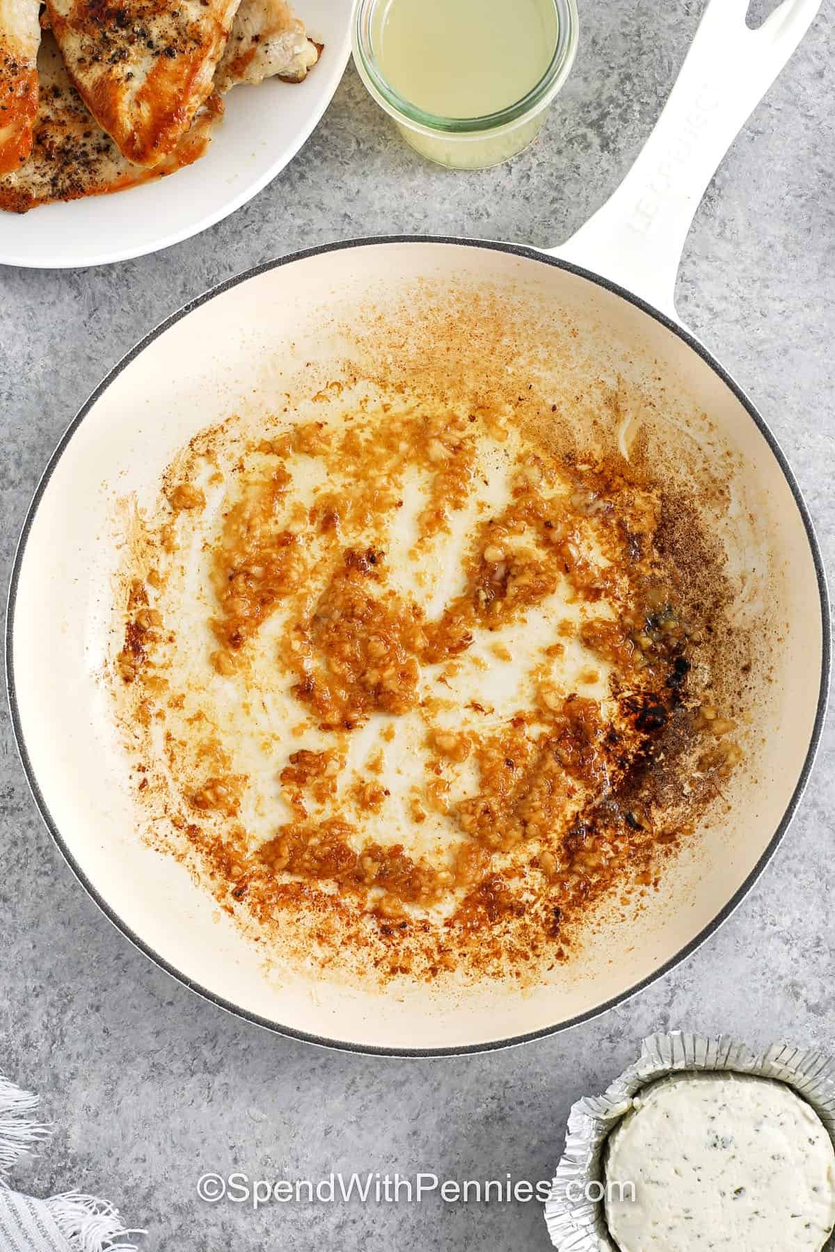 adding garlic to pan after taking chicken out to make Boursin Chicken