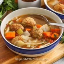 bowl of Cabbage Meatball Soup with a spoon
