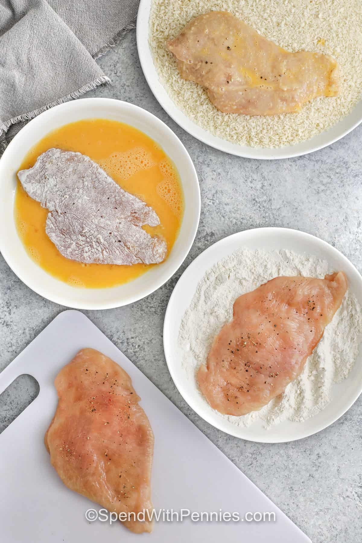 coating chicken in egg wash , flour and panko bread crumbs to make Chicken Katsu