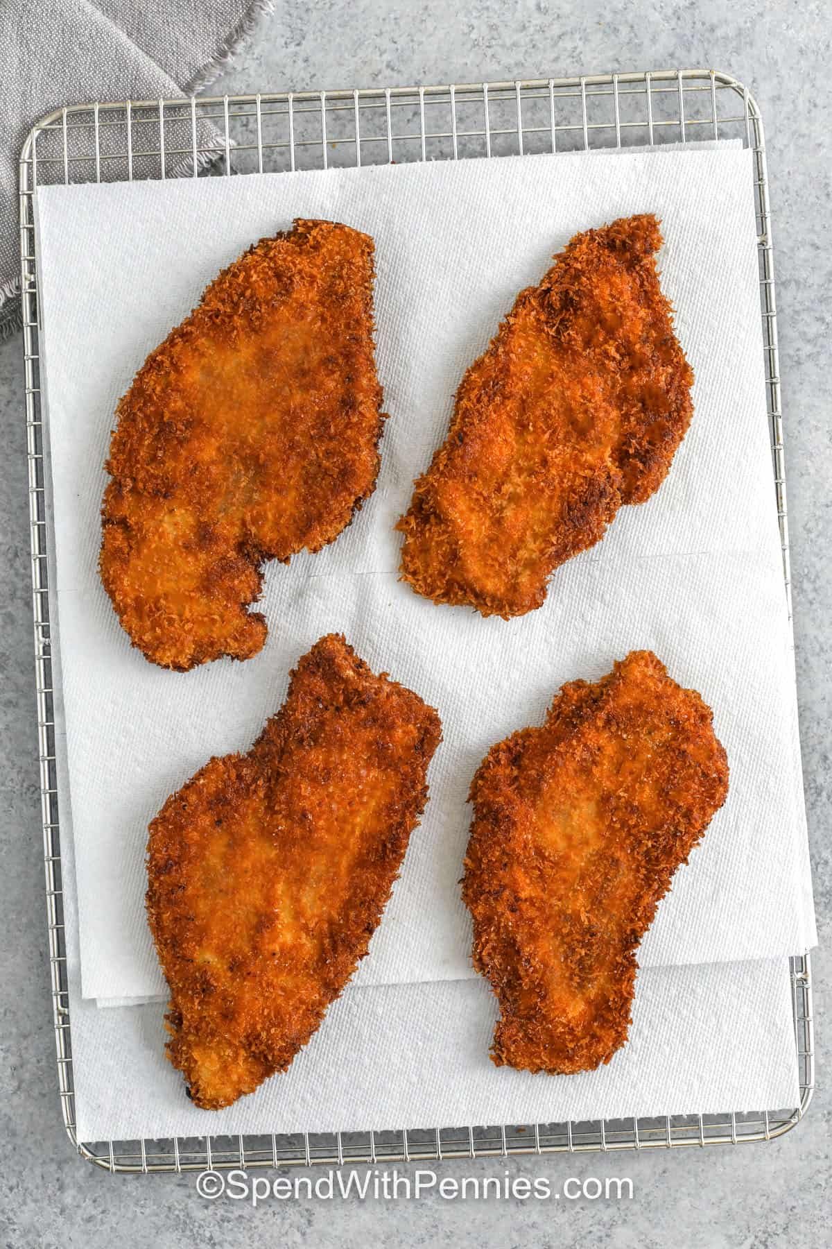 crunchy Chicken Katsu on a metal rack with paper towel