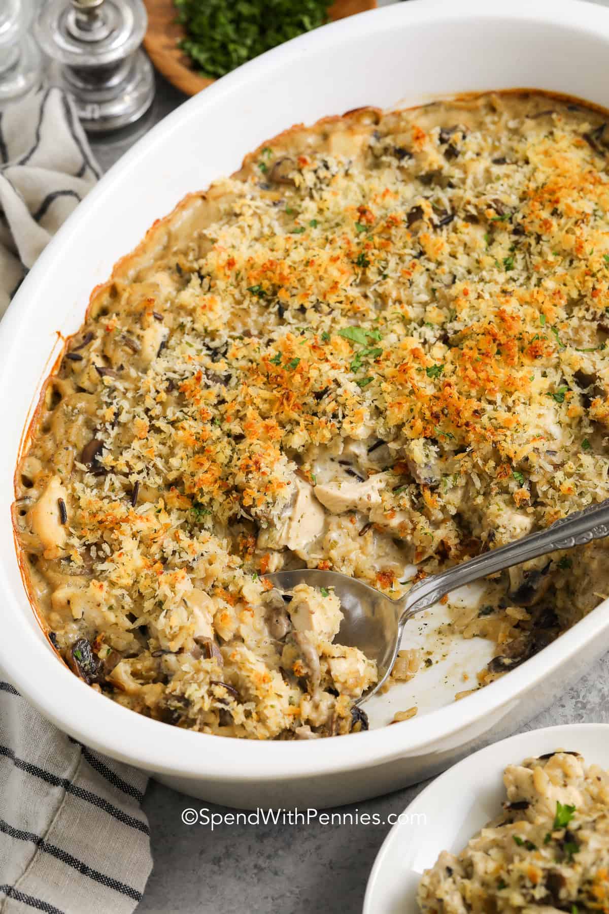 taking a spoonfull of Chicken Mushroom Casserole out of the dish