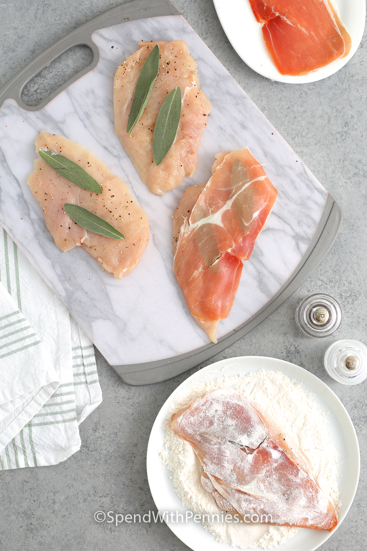 The process of layering seasoned chicken, sage leaves, and prosciutto and then coating in flour to make chicken saltimbocca