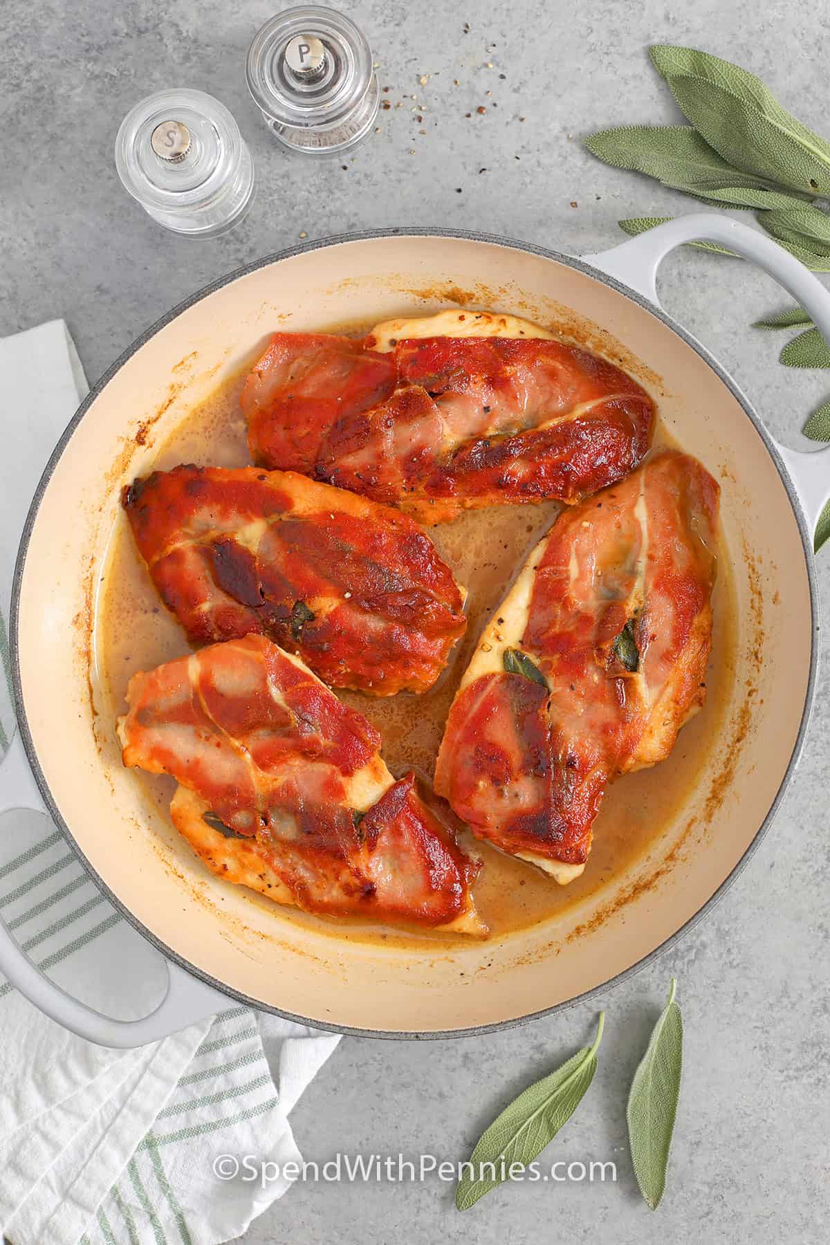 Skillet with chicken saltimbocca in a butter and white wine sauce