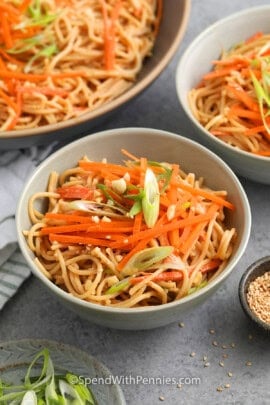 cold sesame noodle salad in white bowl