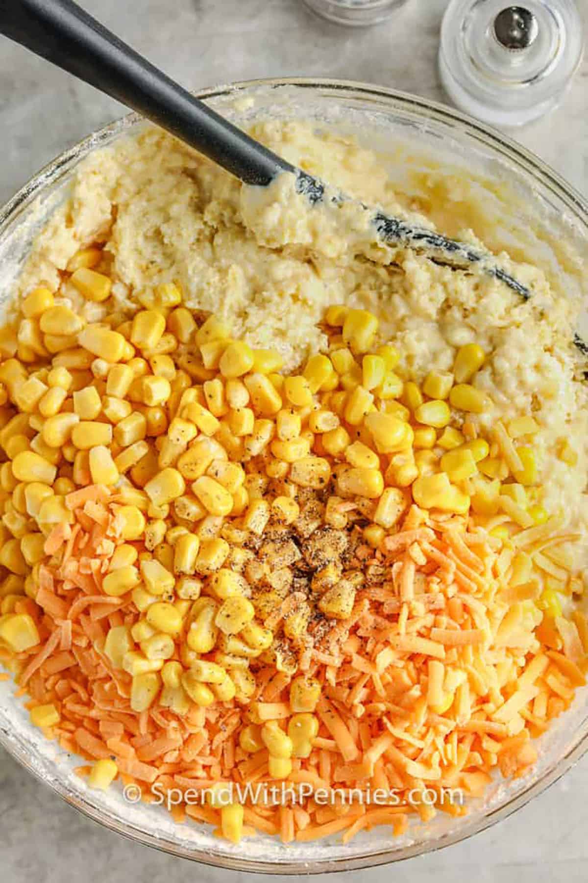 mixing ingredients together in bowl to make Cornbread Casserole
