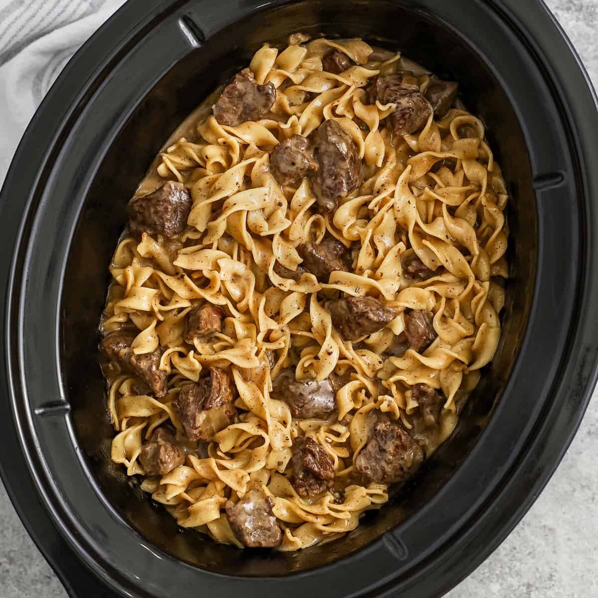 savory Crock Pot Beef and Noodles in the pot