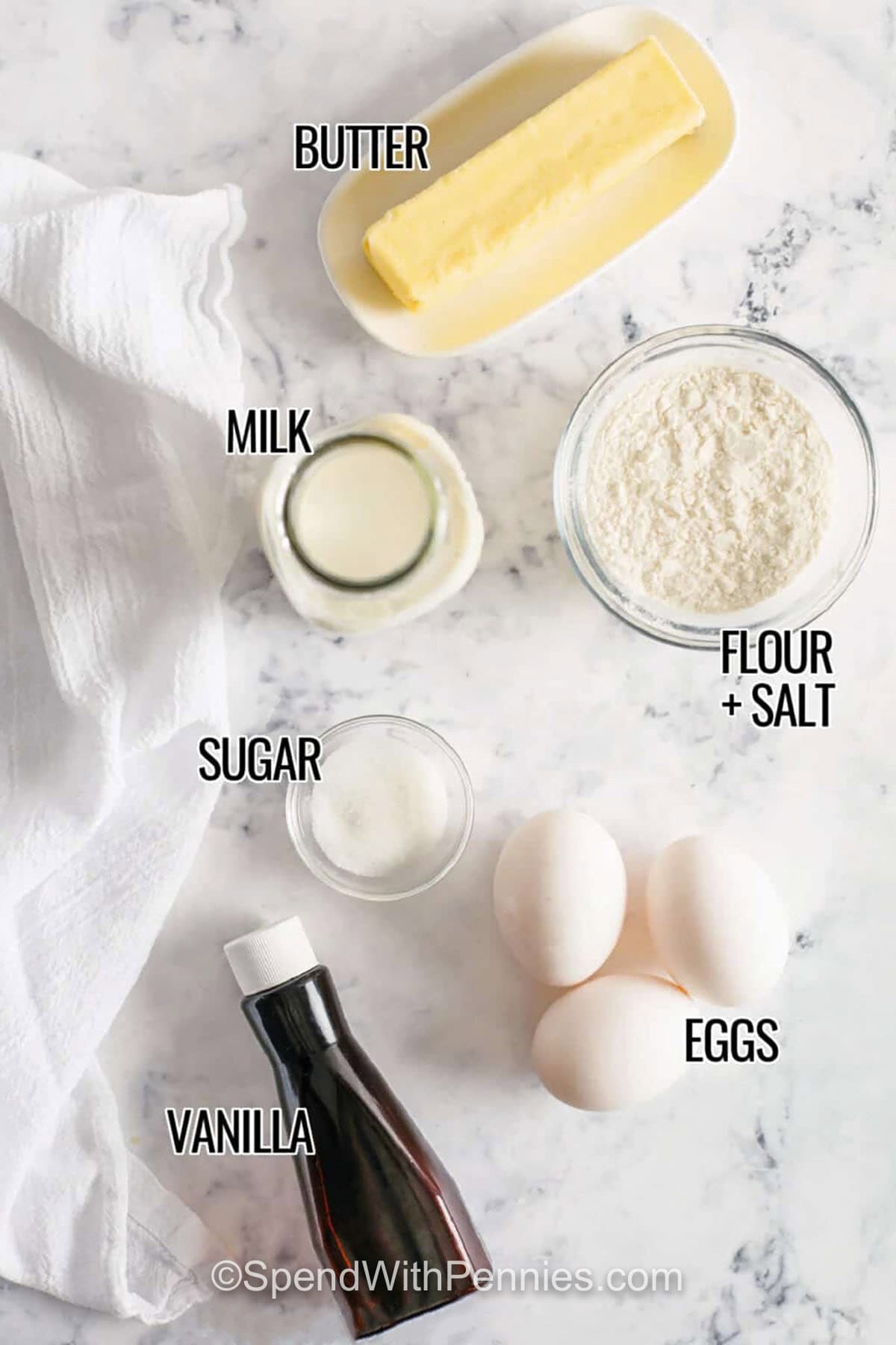 vanilla , sugar , milk , butter , eggs , flour and salt with labels to make Dutch Baby Pancakes