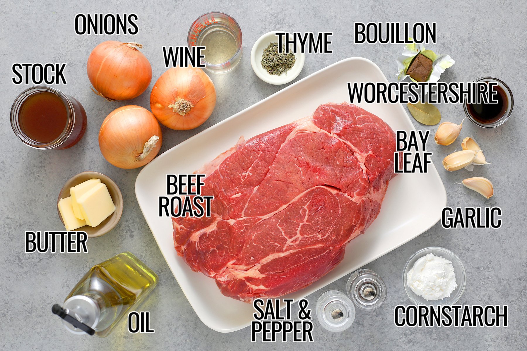 Chuck roast, onions, wine, stock, butter, oil, thyme, bay leaf, bouillon, Worcestershire, garlic, cornstarch, and salt and pepper to make Crockpot French Onion Pot Roast.
