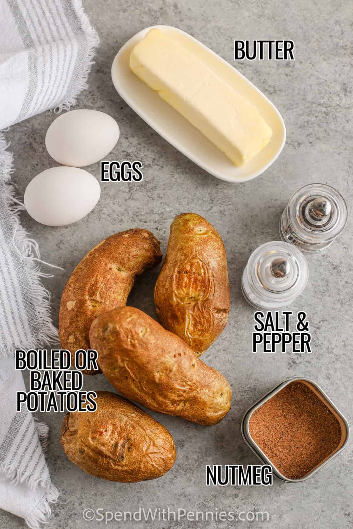 Duchess potatoes are a sophisticated yet simple side made by piping smooth, buttery mashed potatoes into swirls and baking until golden. The crisp exterior contrasts with the delicate interior, offering a refined presentation with comforting flavor. This recipe is great for meal prep because the potatoes can be assembled early and stored in the freezer until baking. #spendwithpennies ingredients to make duchess potatoes including butter, eggs, salt, pepper, nutmeg, and potatoes