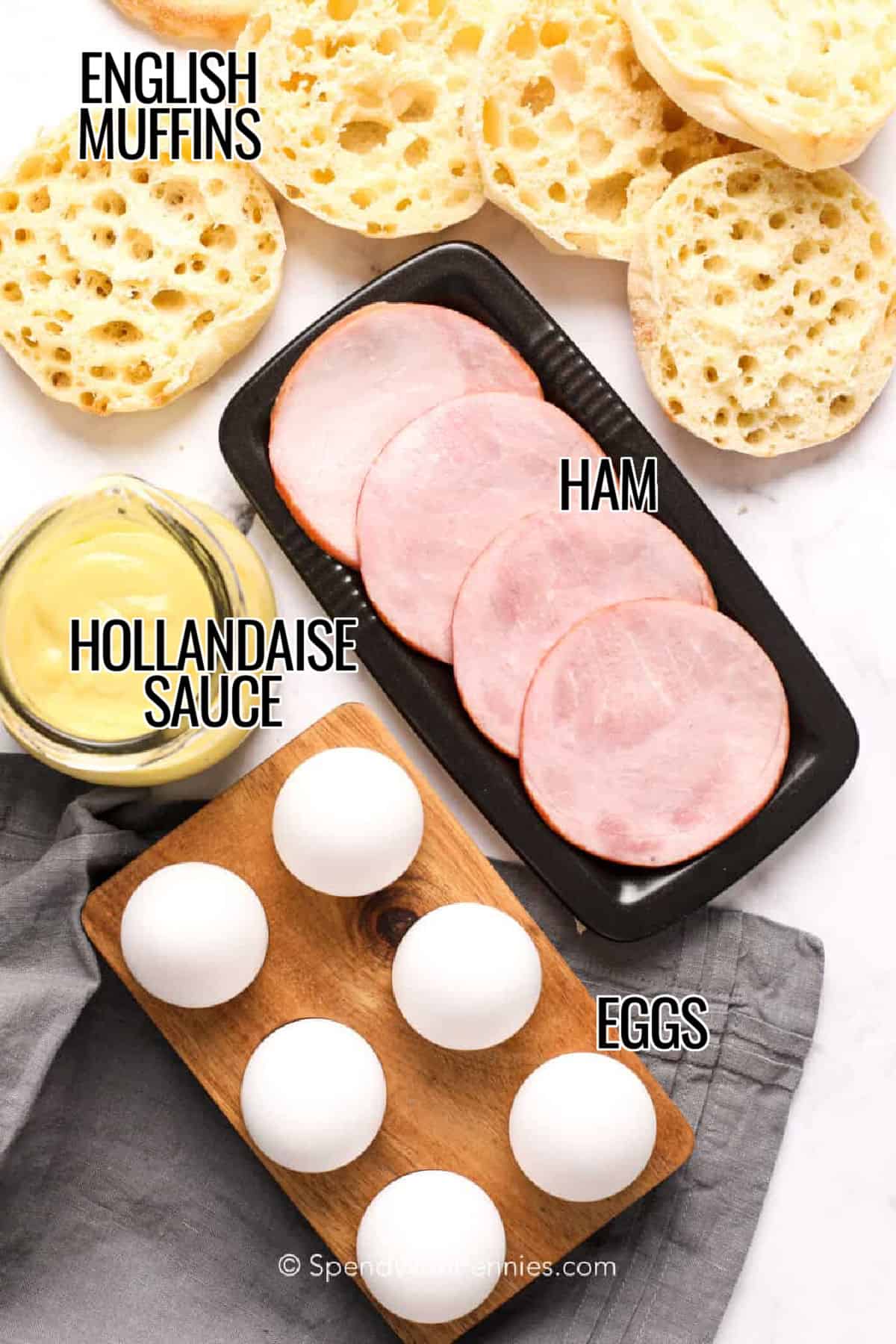 english muffins , hollandaise sauce , ham and eggs to make Eggs Benedict