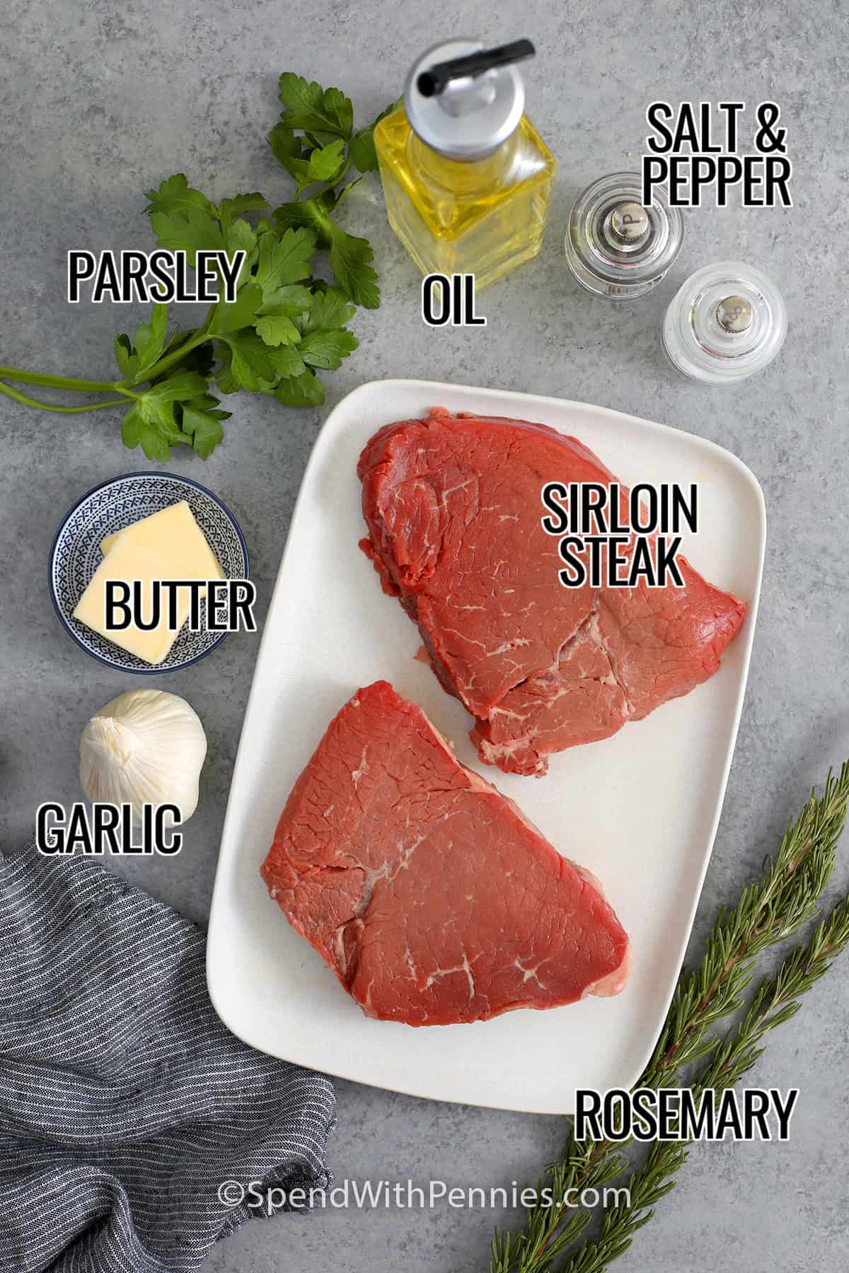 Sirloin steak, rosemary, garlic, butter, parsley, oil, and salt and pepper with labels to make Garlic Butter Steak Bites