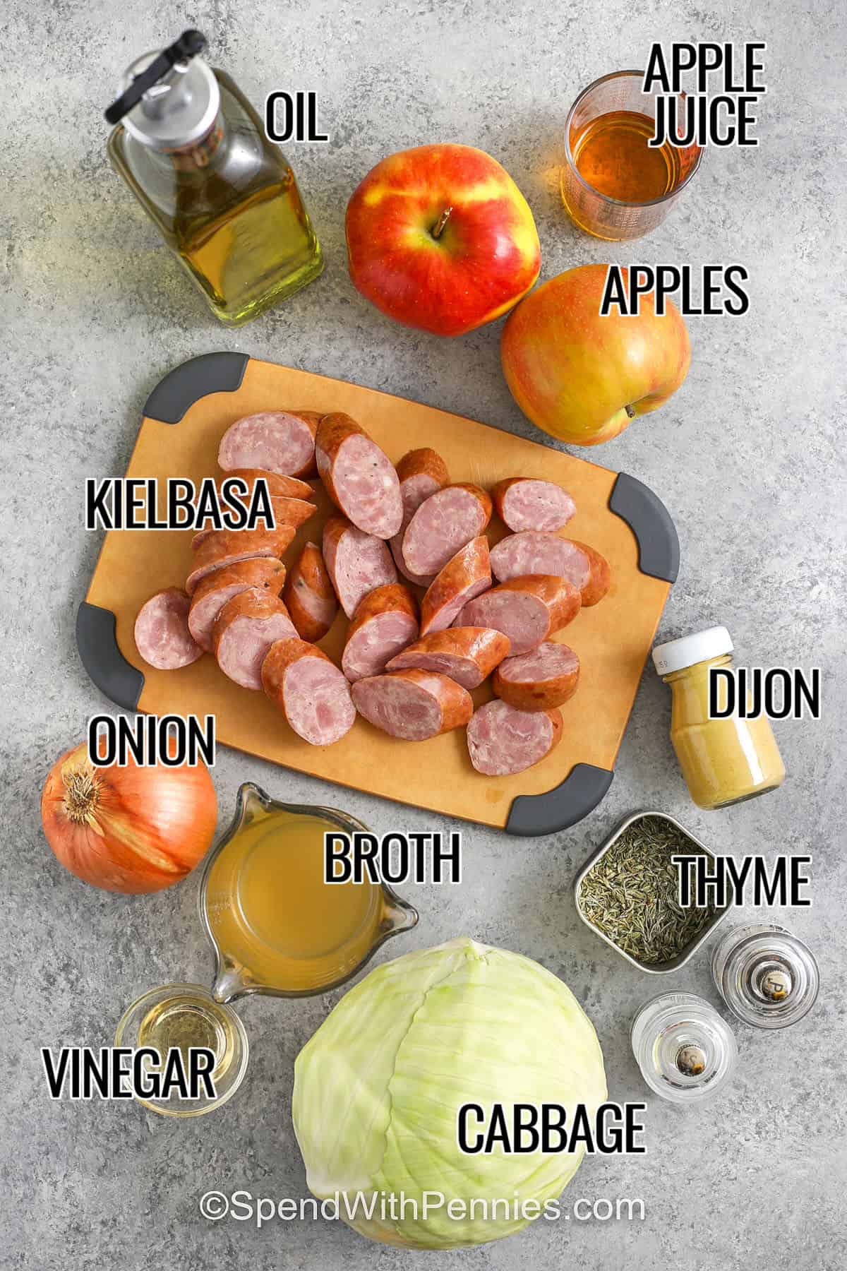 oil , apples , apple juice , kielbasa , dijon , onion , broth , thyme , cabbage , vinegar with labels to make Sausage, Cabbage, and Apple Skillet