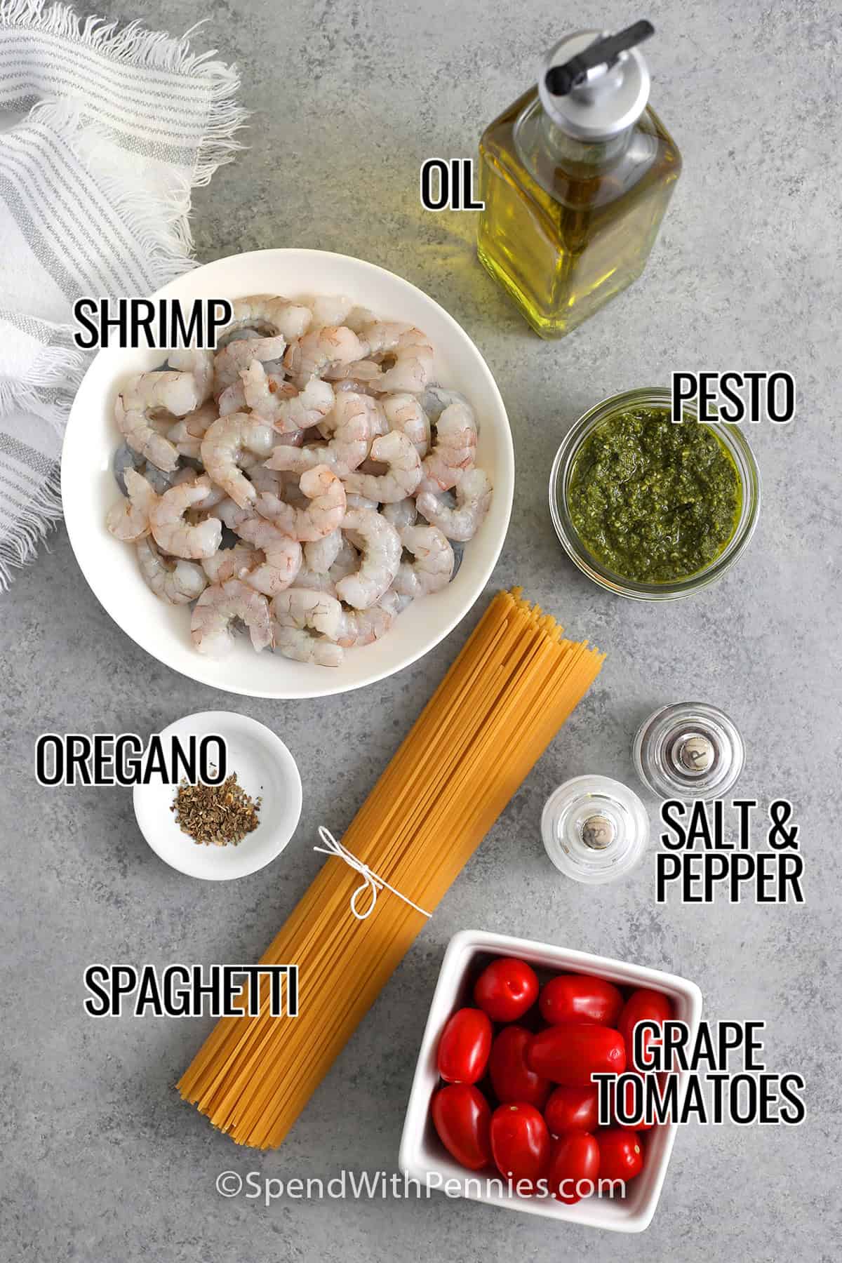 Shrimp, oil, pesto, oregano, spaghetti, grape tomatoes, salt, and pepper with labels to make Shrimp Pesto Pasta