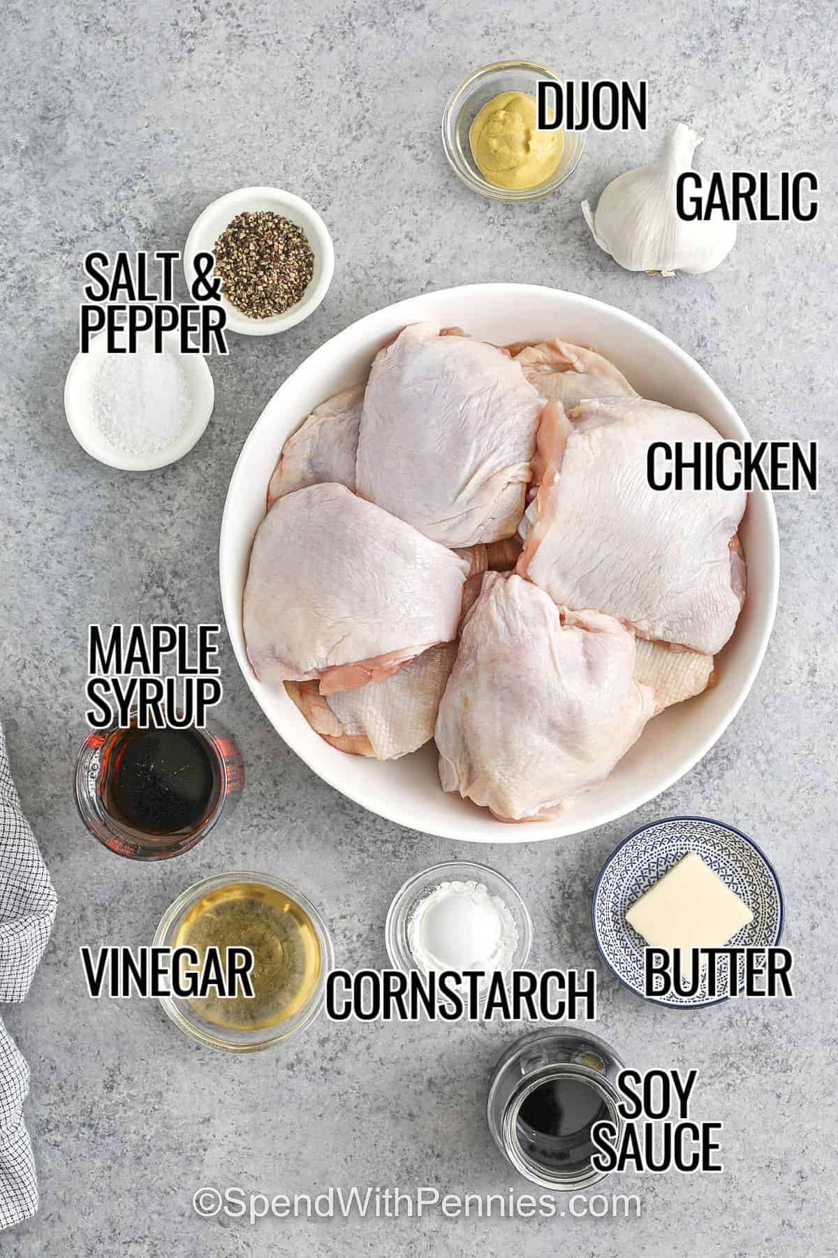 These sticky chicken thighs bake up juicy and tender. They have a delish maple garlic glaze that turns thick, glossy, and flavorful. The combination of maple syrup, soy sauce, Dijon, and garlic creates a balanced sweet-savory sauce that caramelizes into a sticky glaze in the oven. This recipe uses simple ingredients, easy prep, and delivers a comforting main dish perfect for busy weeknights or meal prep with plenty of extra sauce for serving. #spendwithpennies chicken , dijon , garlic , butter , cornstarch , soy sauce , vinegar , maple syrup , salt and pepper with labels to make Sticky Chicken Thighs