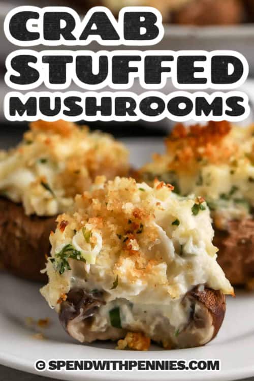 close up of cheesy Crab Stuffed Mushrooms with a title