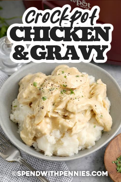 If you love crockpot chicken and gravy, this version is all about a smooth, lump-free sauce. Start by whisking cornstarch into broth, then add evaporated milk, bouillon, and seasonings for deep savory flavor. After the chicken is cooked, thicken the gravy and finish with butter for richness. Serve with mashed potatoes and a side of vegetables. #spendwithpennies Crockpot chicken and gravy served over mashed potatoes in a bowl and garnished with parsley with text.