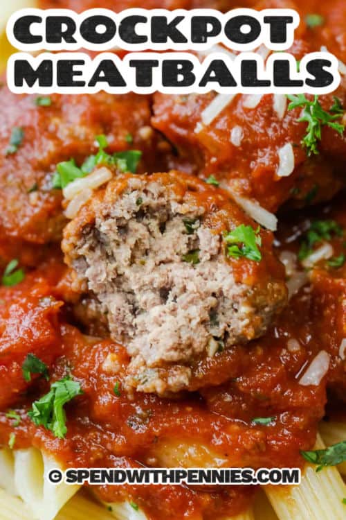 Crockpot meatballs are the easiest way to get tender, juicy meatballs without browning. A simple mix with Parmesan, parsley, and Italian seasoning cooks right in a rich marinara tomato sauce, so every bite stays flavorful. Serve these slow cooker meatballs over spaghetti, spoon extra sauce on top, and finish with more Parmesan for a cozy Italian-style dinner that is great for meal prep. #spendwithpennies Crockpot Meatballs on pasta with a bite taken out of one and a title