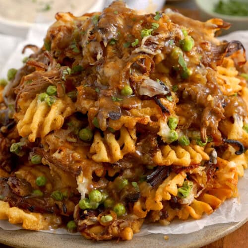 a close up of pot roast nachos