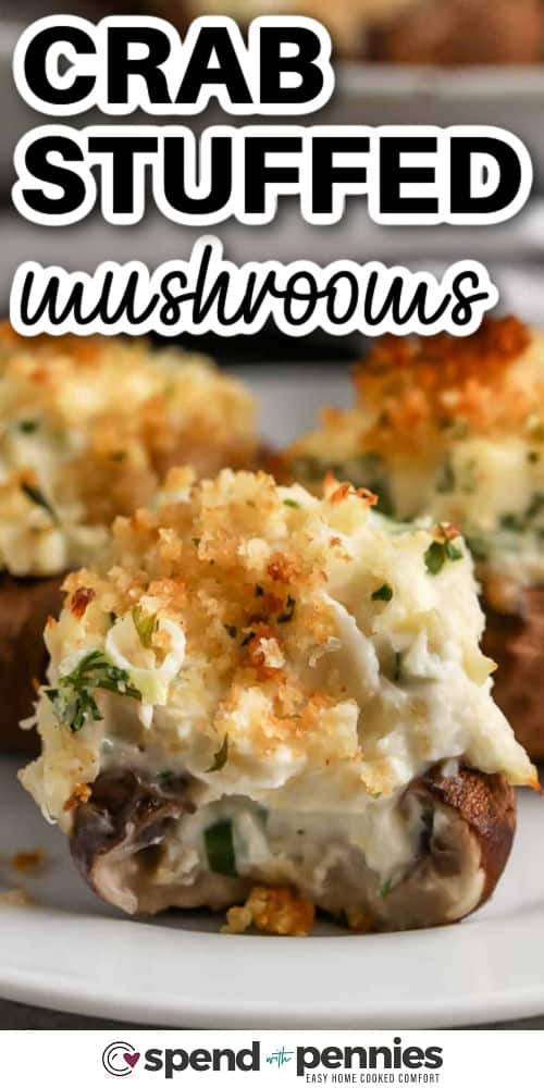 Crab Stuffed Mushrooms on a plate with a title