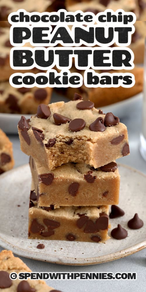 Stack of three Chocolate Chip Peanut Butter Cookie Bars on a plate with a bite out of the top one and text.