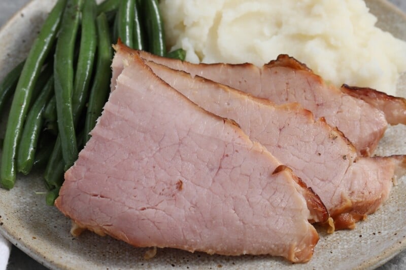 a plate of ham dinner