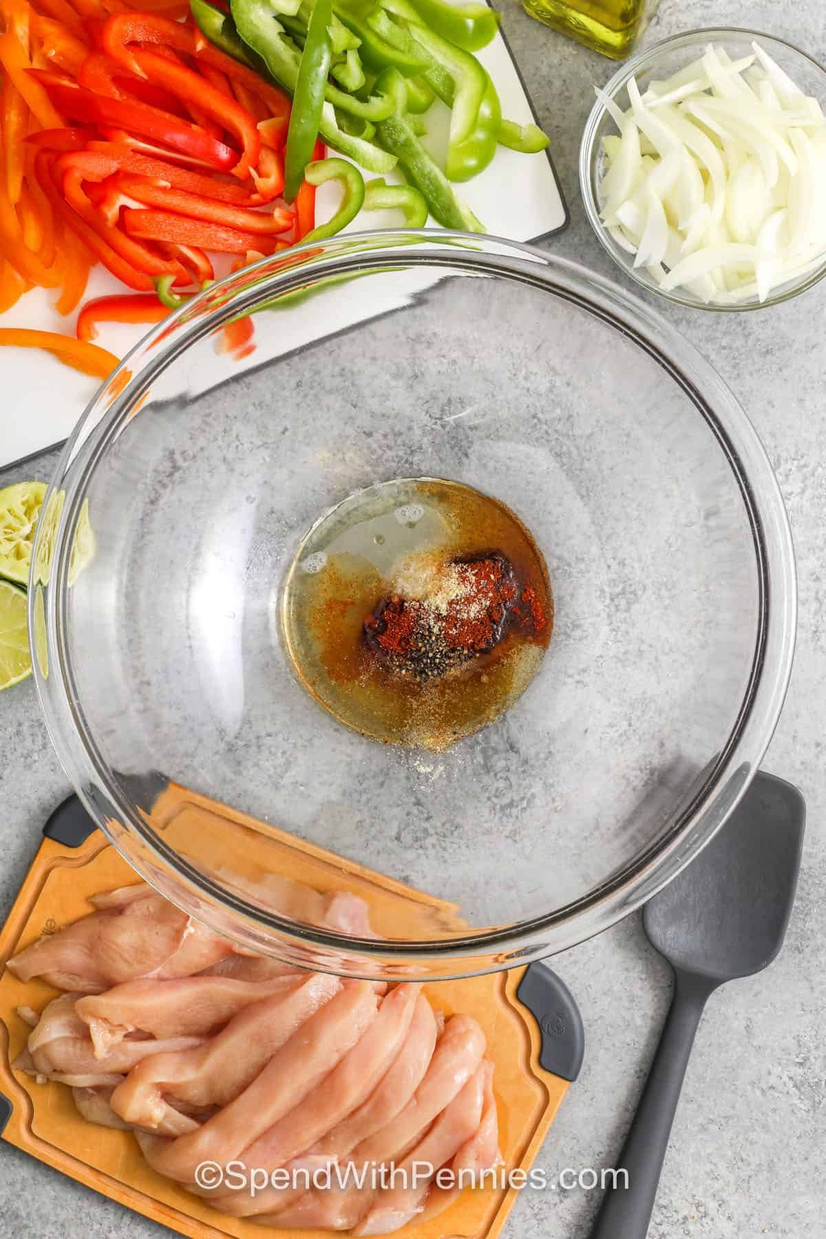adding ingredients to bowl to make sauce for Sheet Pan Chicken Fajitas
