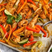 taking Sheet Pan Chicken Fajitas off the sheet pan
